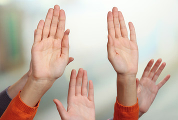 Human hands on bright background