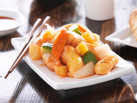 chinese sweet and sour chicken with chopsticks