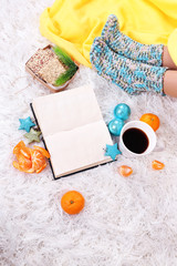 Composition with warm plaid, book,k and female legs,