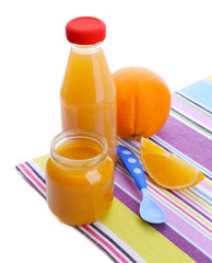 Jars of various baby food with orange, isolated on white