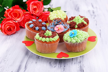 Tasty cupcakes with butter cream,
