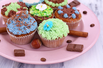 Tasty cupcakes with butter cream,