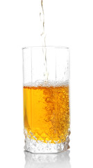 Juice pouring into glass isolated on white