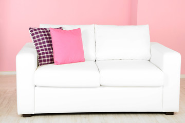 White sofa in room on pink background
