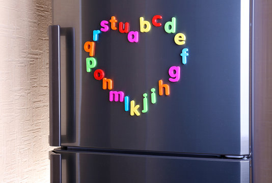 Colorful magnetic letters on  refrigerator