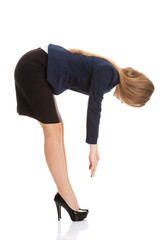 Beautiful caucasian business woman bending down.