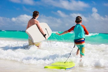 Mother and son with boogie boards