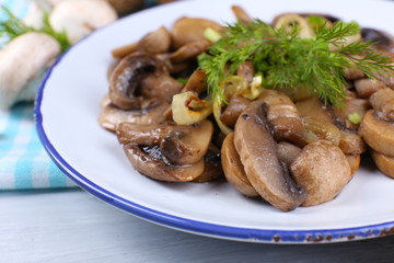 Delicious fried mushrooms on plate on table close-up