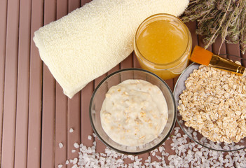 Homemade facial mask with oats and honey,on color wooden