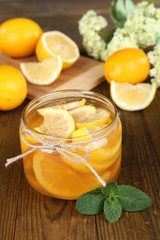 Tasty lemon jam on table close-up