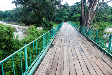 Bridge over Tat Hang waterfall in Laos