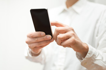 Closeup image of man using a mobile smartphone - 60732559