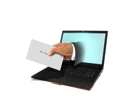 Hand Holding Envelope and Laptop Computer