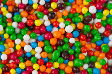 Fototapeta na wymiar Multicolored Sugar Sprinkles as Background