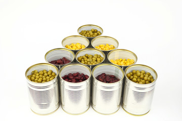 The tins with peas, red bean, corn on the white background