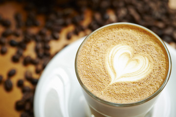 Cappuccino or latte coffee with heart shape