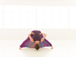 demonstration of yoga pose indor