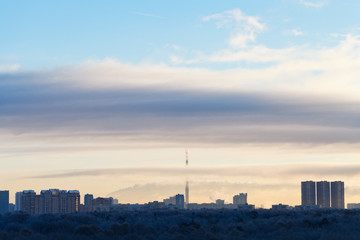Fototapeta na wymiar early morning cloudscape over city park