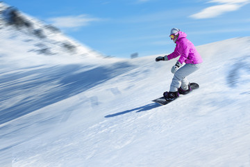 Fototapeta na wymiar Snowboarder at a ski resort