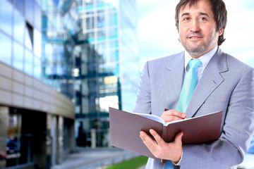 Fototapeta premium Portrait of a smiling handsome businessman