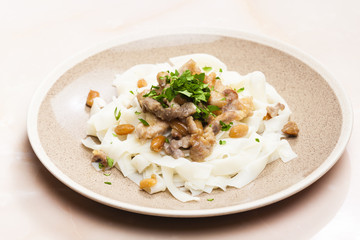 chicken, beef and pork meat with peanuts and rice noodles