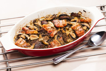 baked chicken livres with bacon and mushrooms on garlic