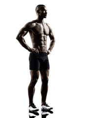 young african shirtless muscular build man standing silhouette