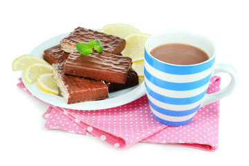 Cup of tea and sweets isolated on white