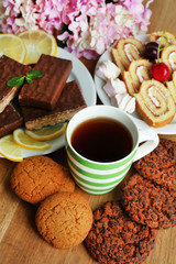 Cup of tea and sweets close up