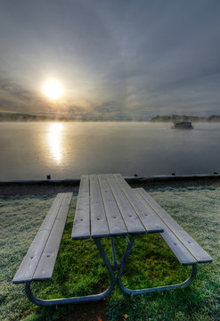 Frosty bench near the lake