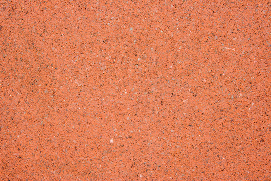 Playground red rough floor pattern background