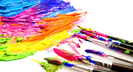 Paints and brushes isolated on a white