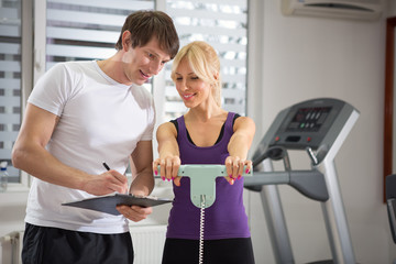 Personal trainer working with his client
