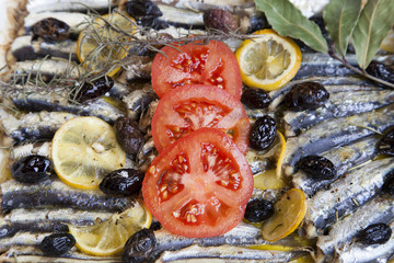 Fototapeta na wymiar Crispy baked fresh sardines, mackerel fishes