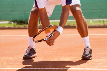 Zelfklevend Fotobehang tennis player's legs © luckybusiness