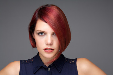 Female fashion model with short red hair