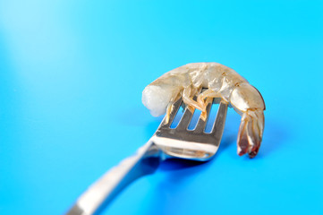 shrimp on fork isolated blue