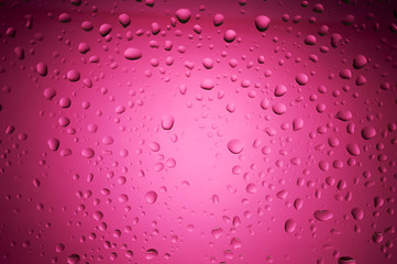 crimson color water drops on glass