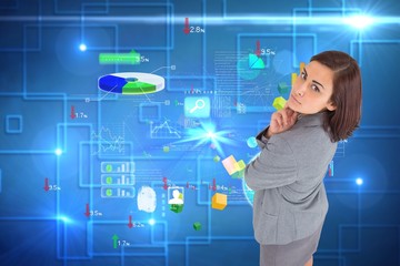 Composite image of focused businesswoman