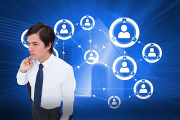 Composite image of young tradesman with his jacket and suitcase