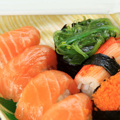 salmon,shrimp,seaweed sushi in foam box