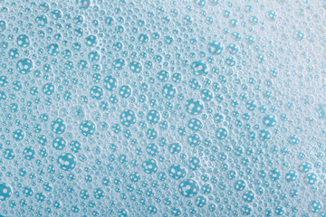 background of suds with bubbles blue close up. macro