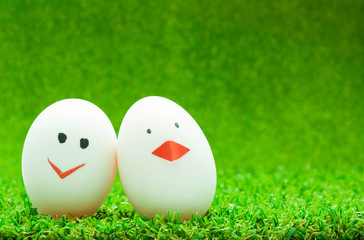 Couple eggs on green background