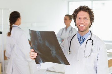 Male doctor examining Xray