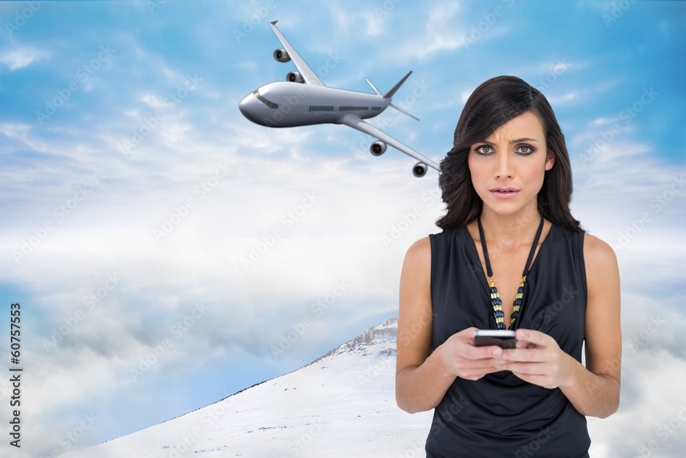 Poster Composite image of serious elegant brown haired model texting