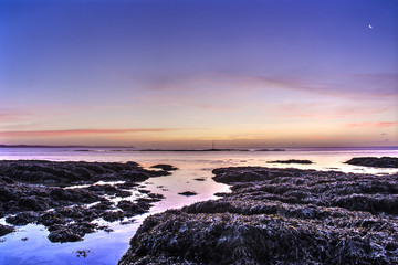Fototapeta premium Hannafore point pink sunrise with crescent moon