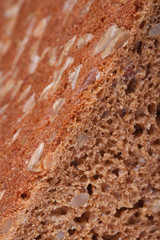 bread with nuts, raisins and sunflower seeds and closeup