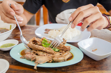 Closeup Spoon and frog to eating chicken soup