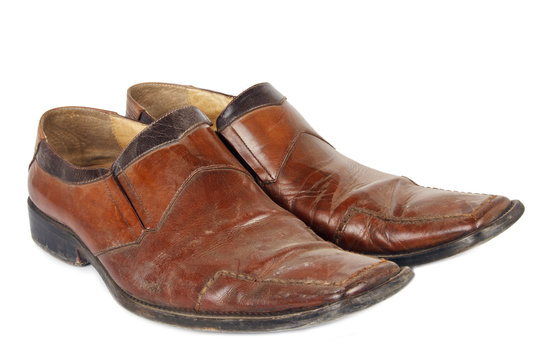 Old brown shoes isolated