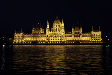 Fototapeta premium Evening view of an illuminated Building of Hungarian Parliament